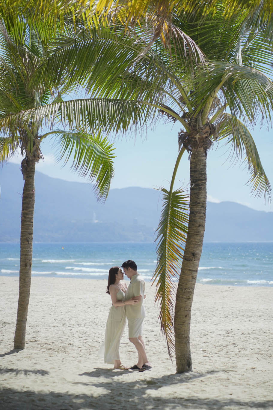 Romantic beach photos at My Khe Beach in Da Nang for couples visiting Vietnam.